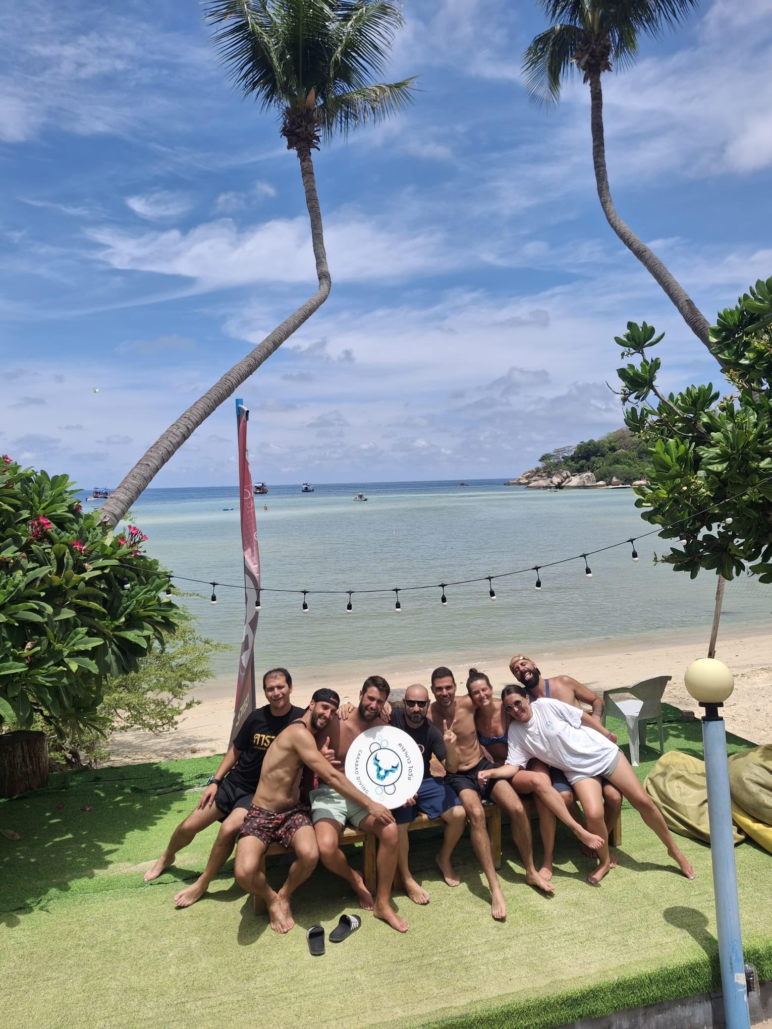 The Carabao Diving team and guests together on the beach in Chalok Bay, Koh Tao